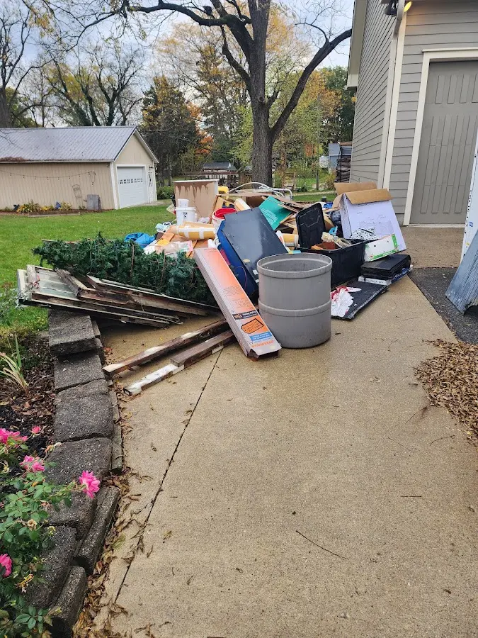 Dumpster being loaded with debris for Commercial Dumpster Rental in Du Quoin
